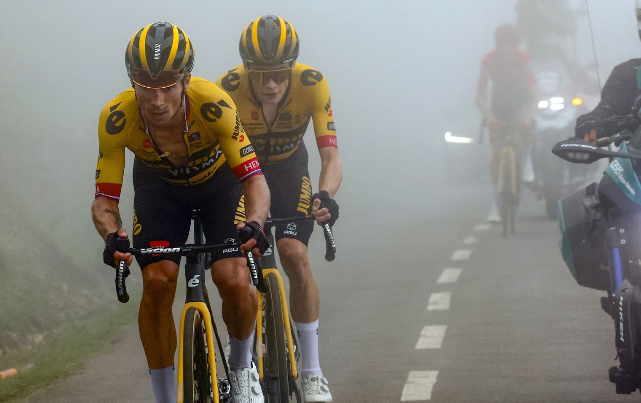 Primoz Roglic and Jonas Vingegaard ride away from Sepp Kuss as they climb the Angliru on Stage 17 of the 2023 Vuelta a Espana.