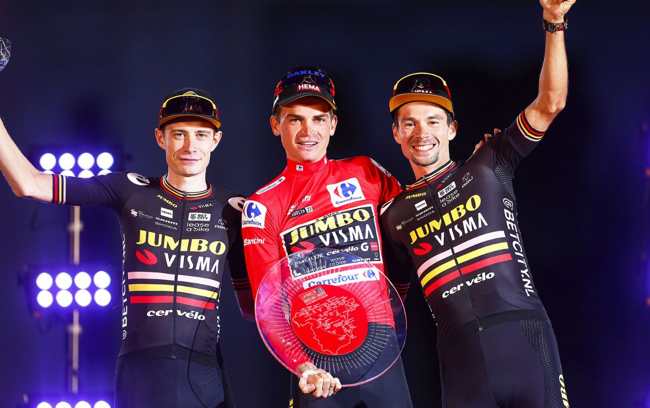 Sepp Kuss and his Jumbo-Visma teammates Jonas Vingegaard and Primoz Roglic celebrate their 1-2-3 finish on the podium of the 2023 Vuelta a Espana.
