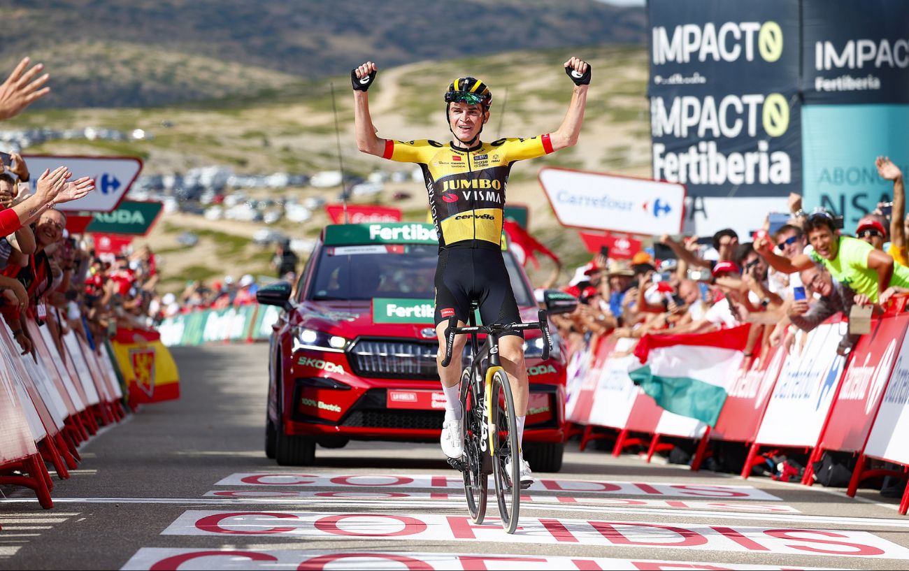 Sepp Kuss celebrates with arms outstretched as he crosses the finish line to win Stage 6 of the 2023 Vuelta a Espana.