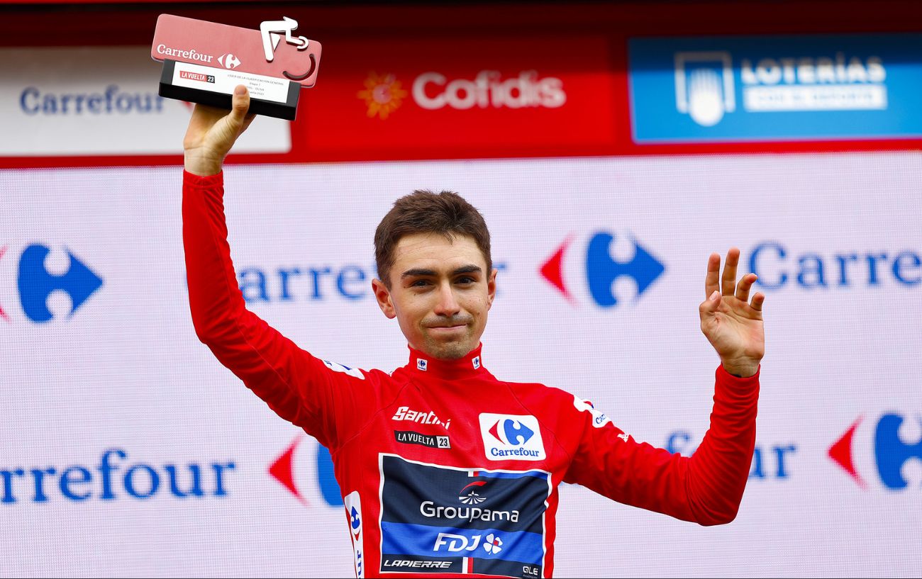 Lenny Martinez is presented with the red jersey after Stage 7 of the 2023 Vuelta a Espana.