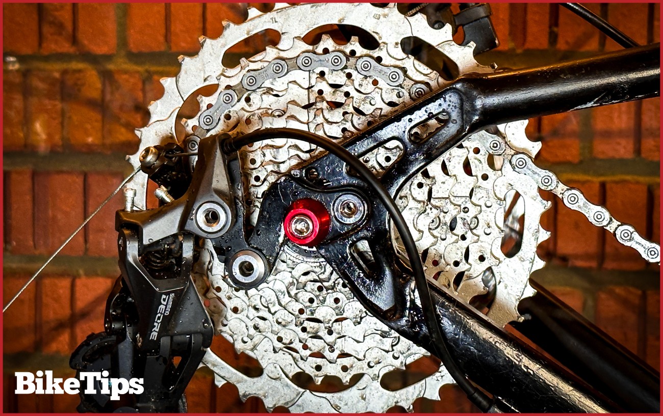 A mountain bike cassette with a Shimano Deore derailleur.