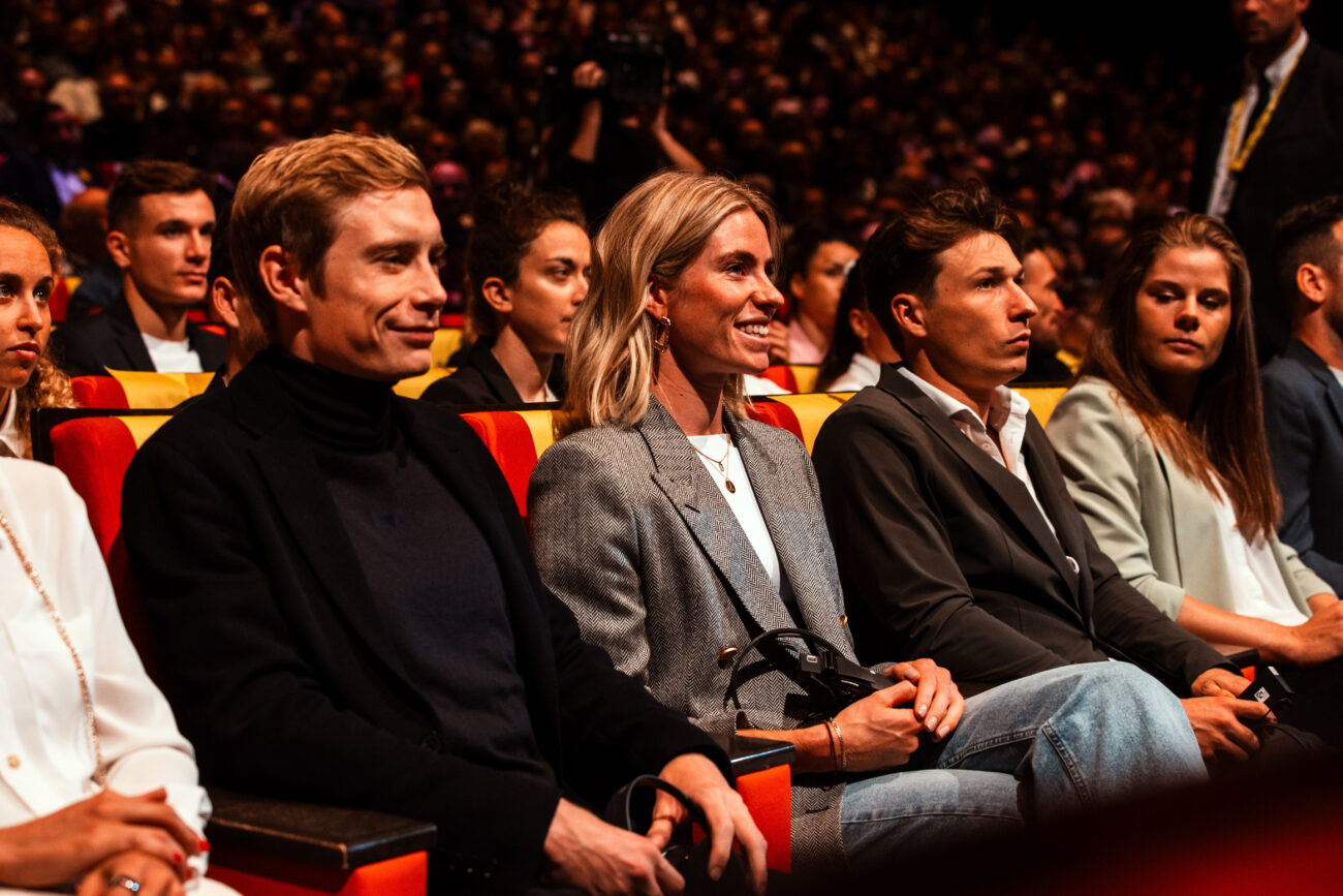 Demi Vollering sits next to Jonas Vingegaard at the presentation for the 2024 Tour de France Femmes route.