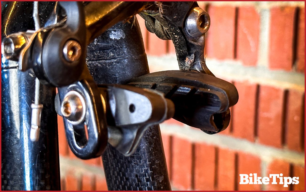A close-up of road bike rim brake pads.
