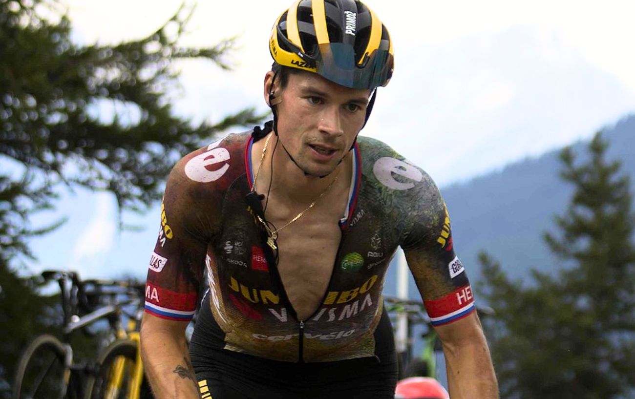 Primoz Roglic climbs a mountain at the 2022 Tour de France while riding for Jumbo-Visma.
