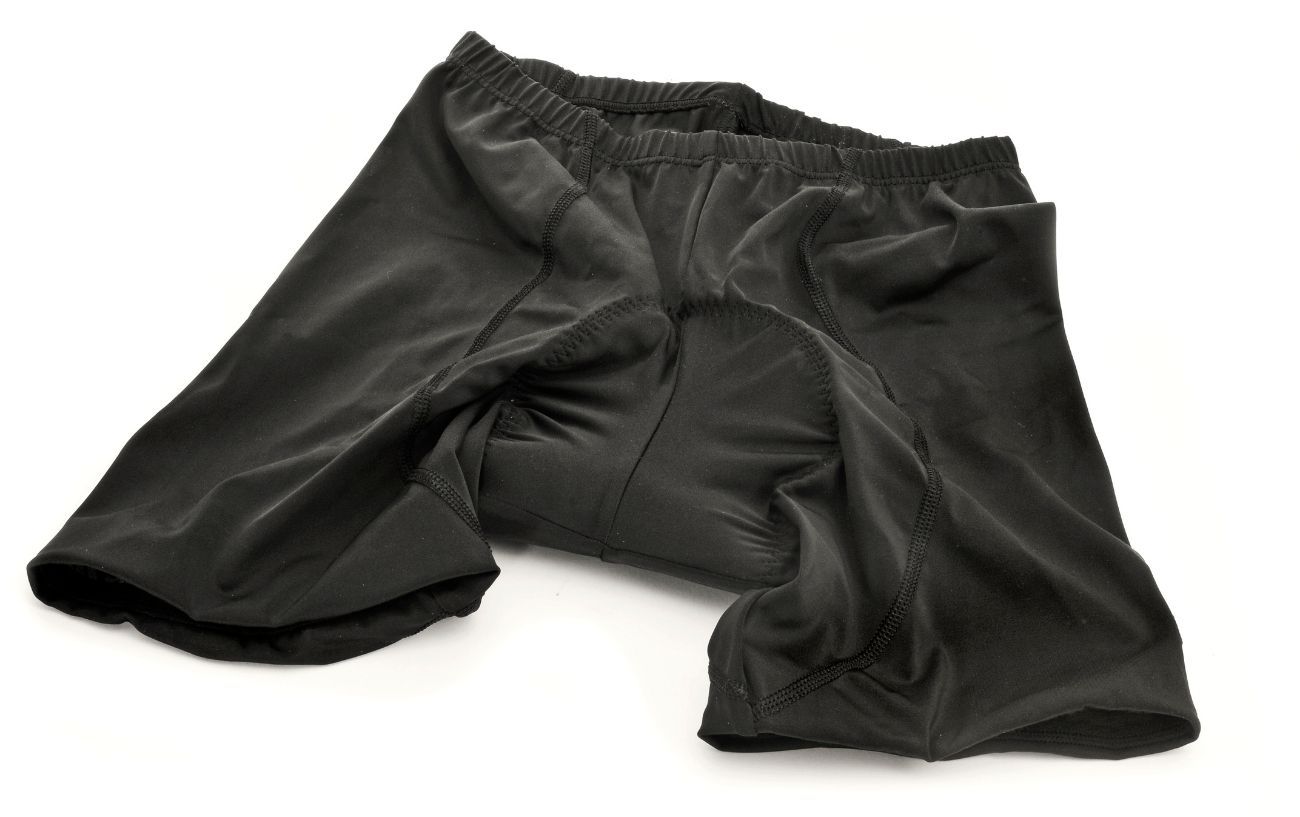 A pair of black cycling bib-shorts white a white background.