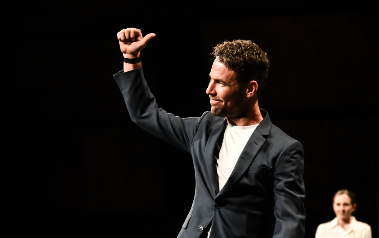 Mark Cavendish appears on stage at the presentation of the 2024 Tour de France route.