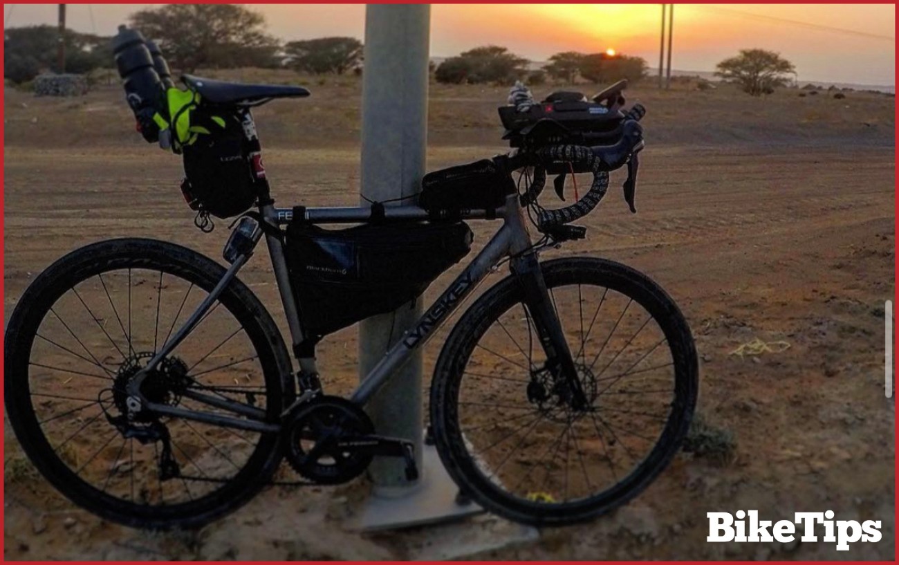 Bikepacking road bike in a sunset in Oman.