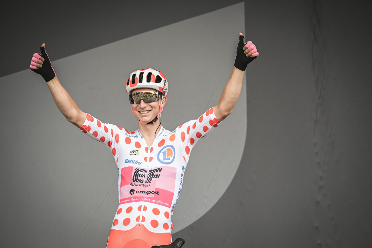 Neilson Powless celebrates in the polka-dot jersey at the 2023 Tour de France.