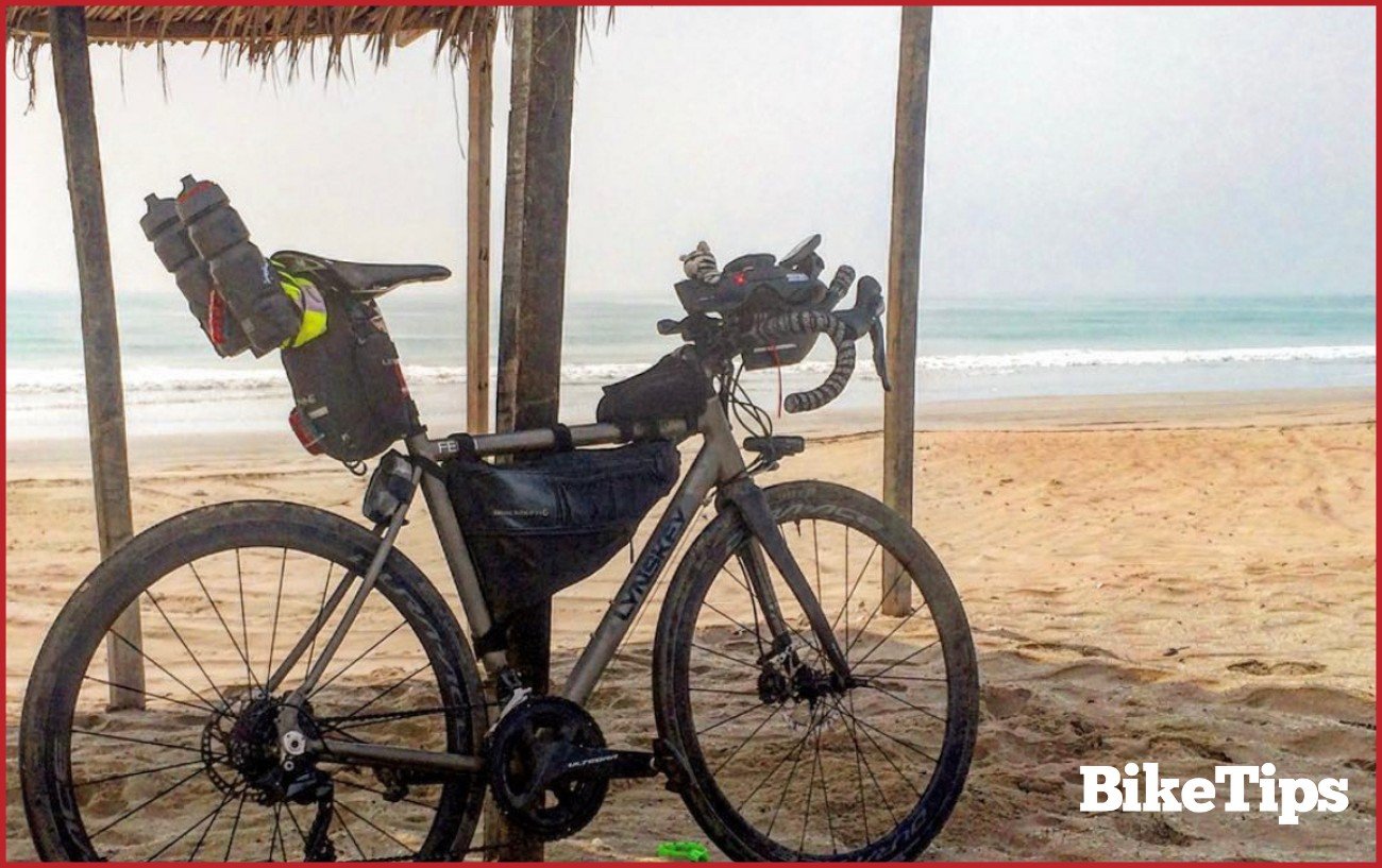 My bike on a beach in Oman at the end of my bikepacking route.