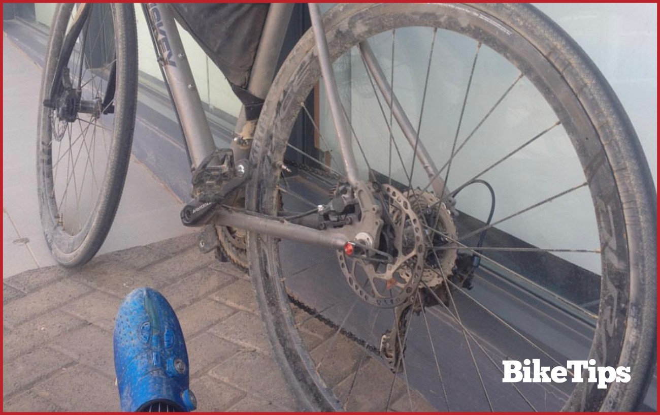 A dust road bike after being ridden on a gravel track.