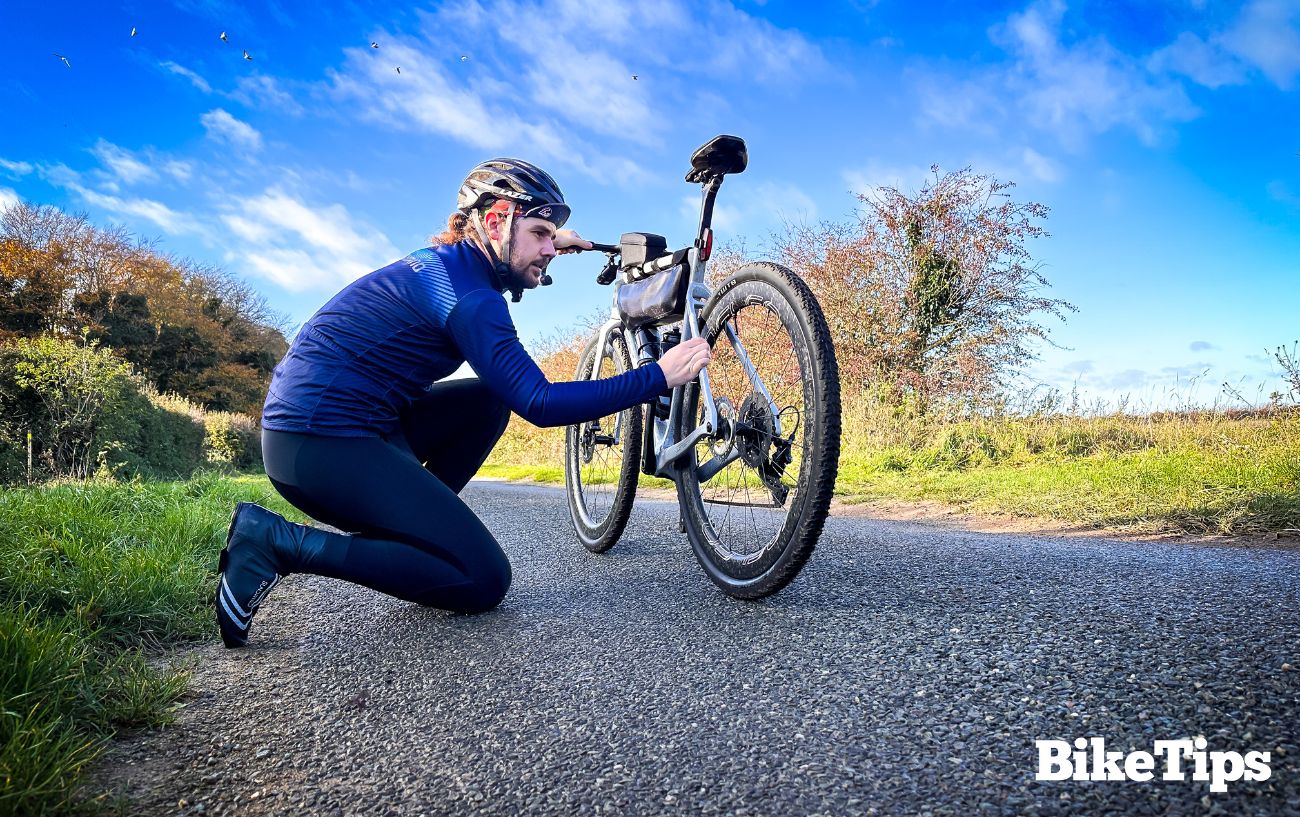 I make repairs to my bike during a randonnee.