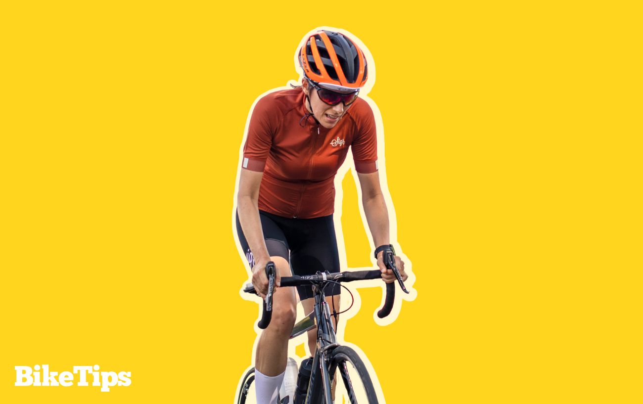 Graphic of a cyclist climbing while wearing a helmet on a yellow background.