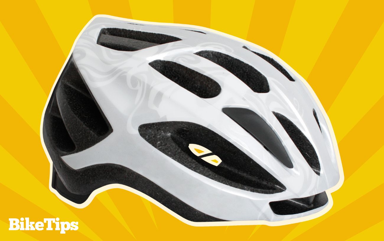 Graphic showing a white bike helmet on a textured yellow background.