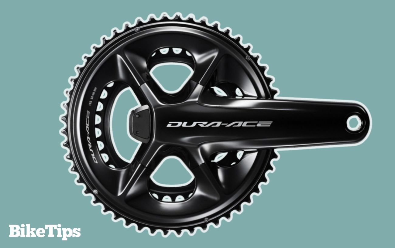 Shimano Dura-Ace crankset on a blue background.