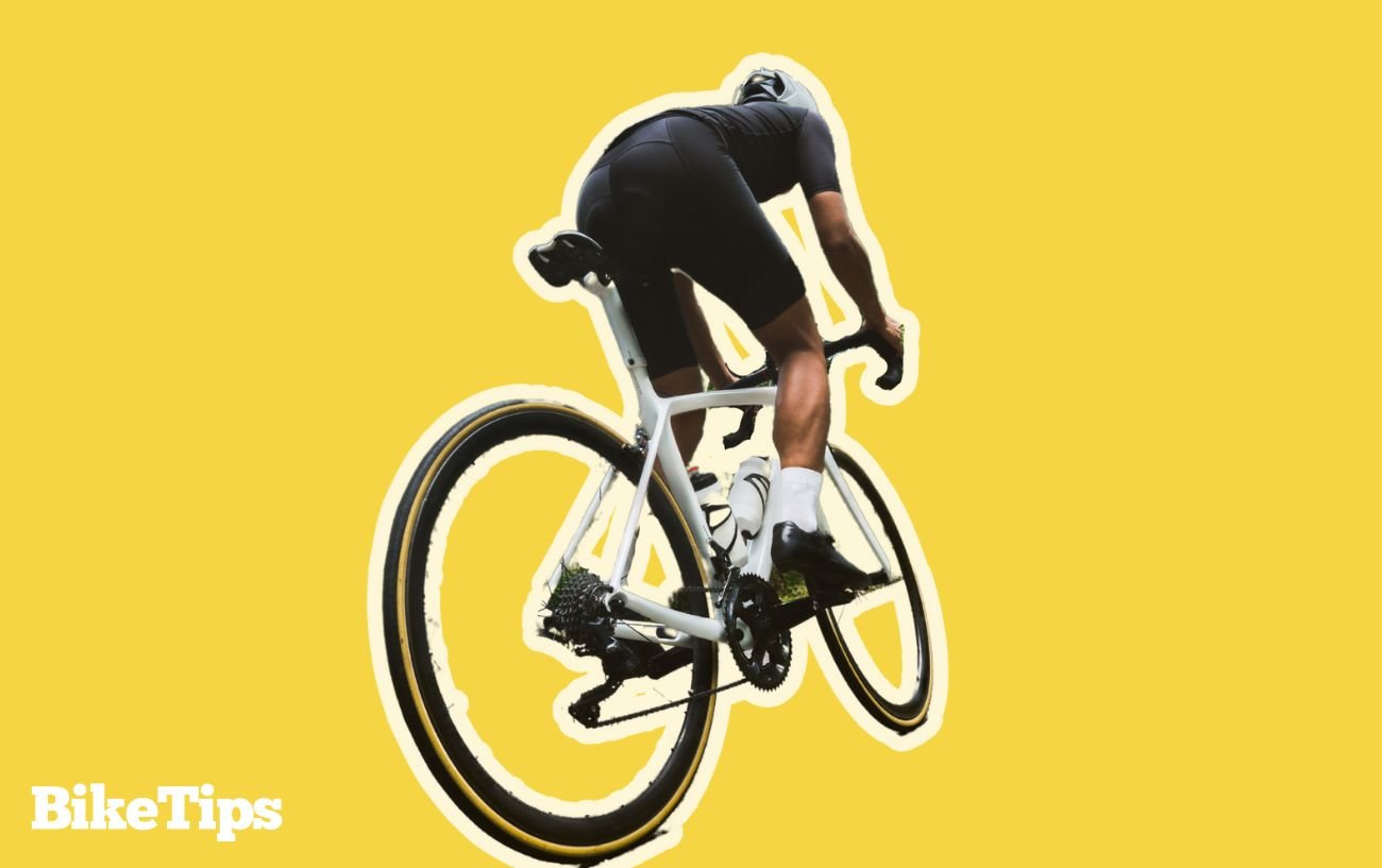 Lydia Gurley 3 Graphic of a cyclist climbing uphill on a white road back on a yellow background.