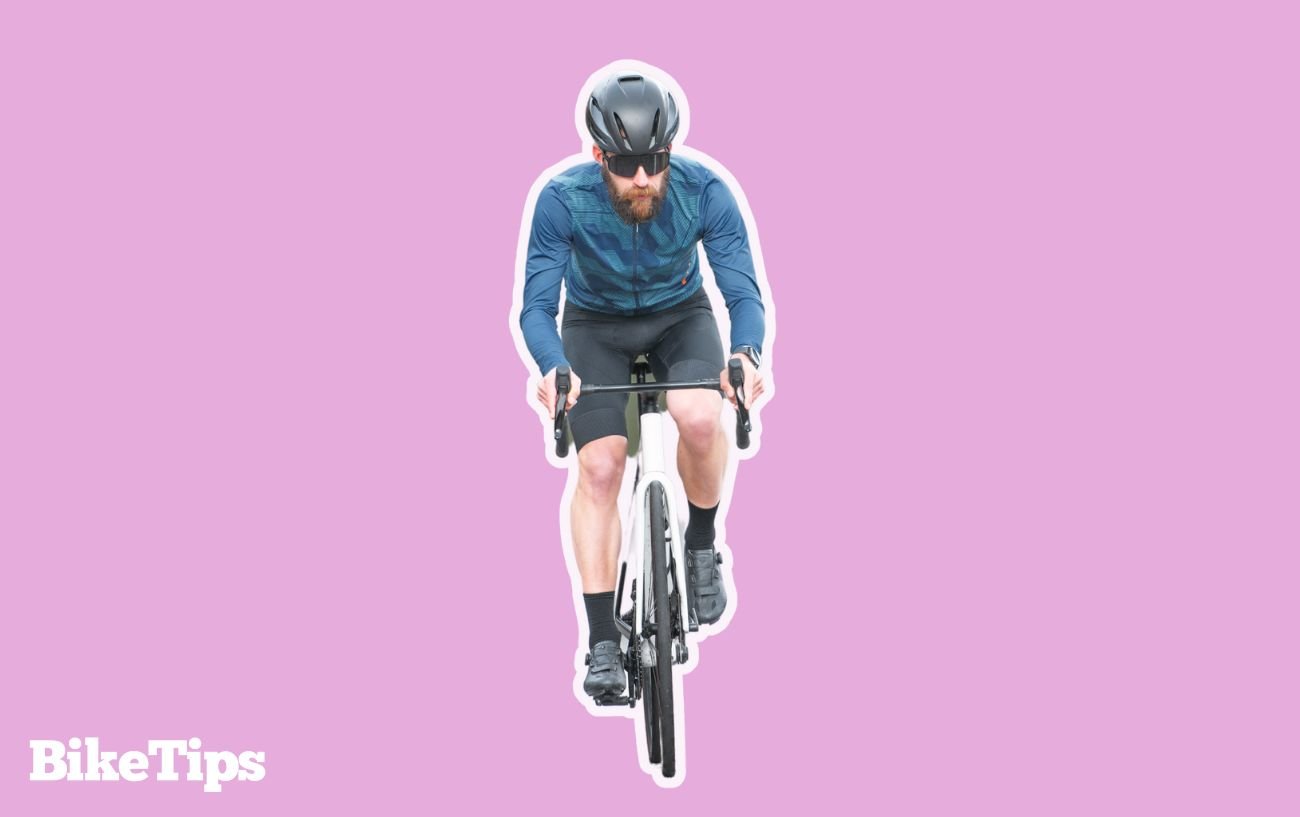 Graphic showing a cyclist biking uphill on a pink background.