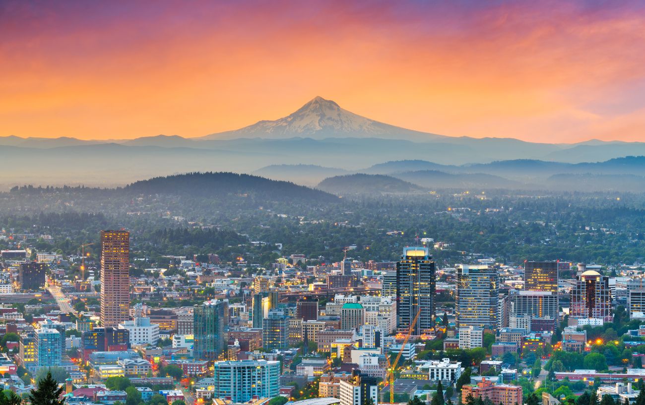 Portland, Oregon, shot at sunset with a mountain in the background, is one of the most bike-friendly cities in USA.