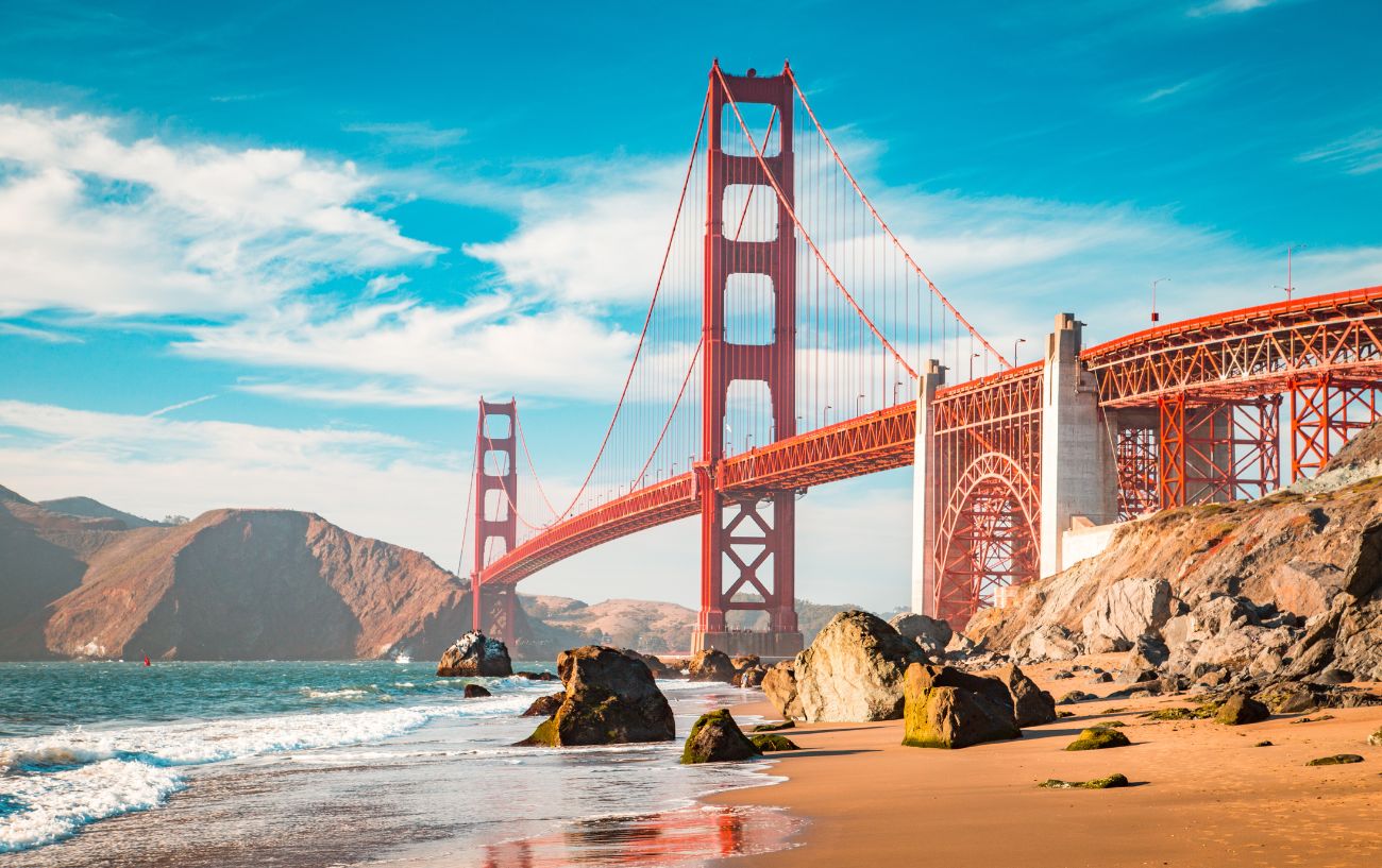 A beach in San Francisco with the Golden Gate Bridge in the background.