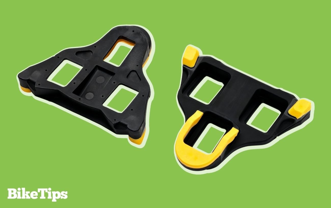 Graphic of Shimano SPD-SL cycling cleats on a green background.