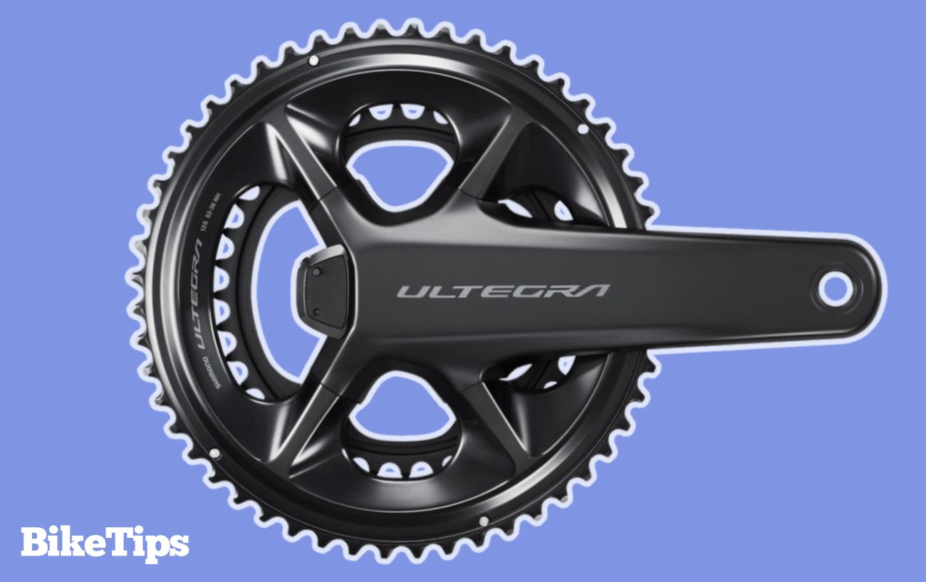 An Ultegra crankset on a purple background.