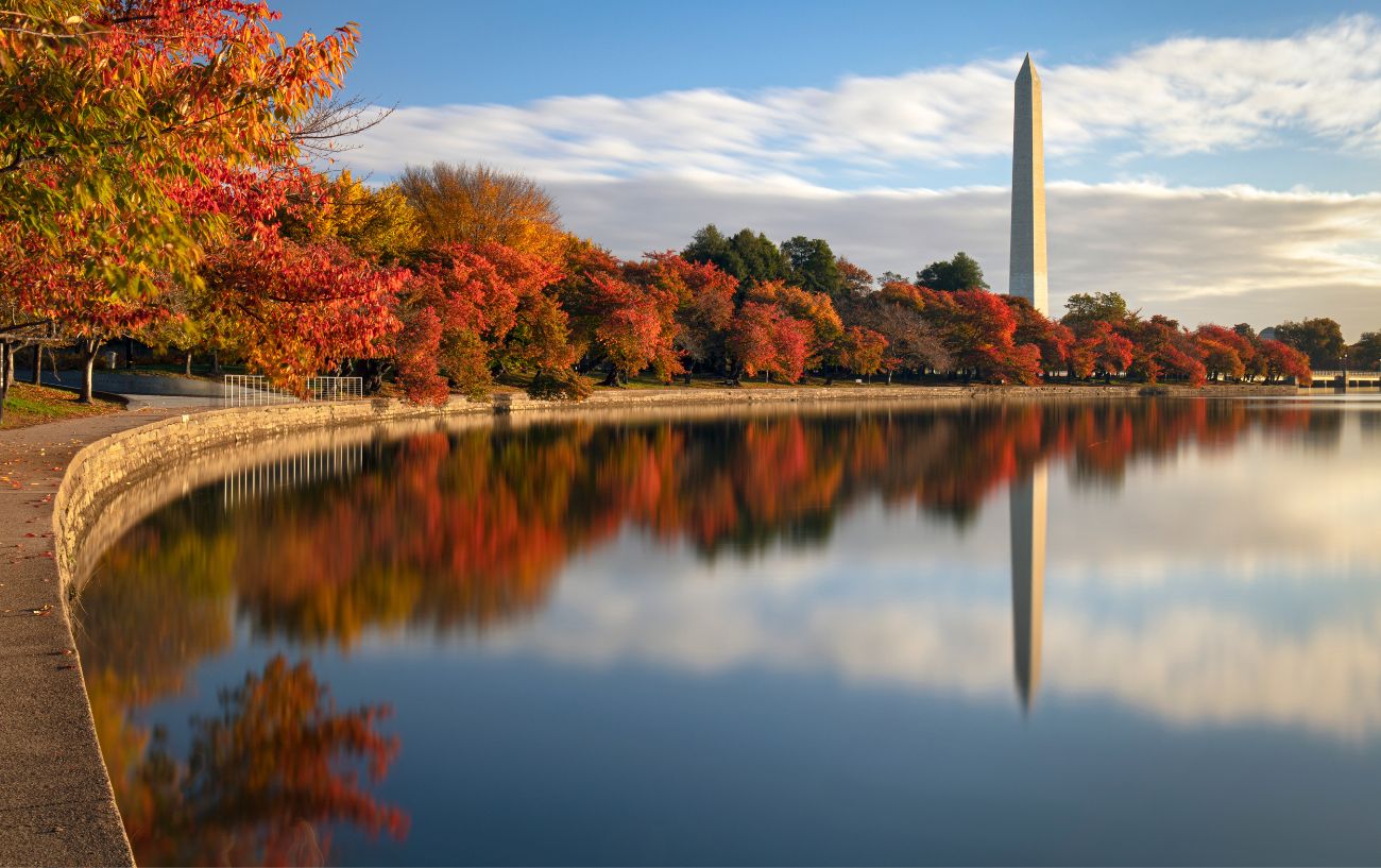Photo of a cycling path by a lake in Washington, D.C. in fall.