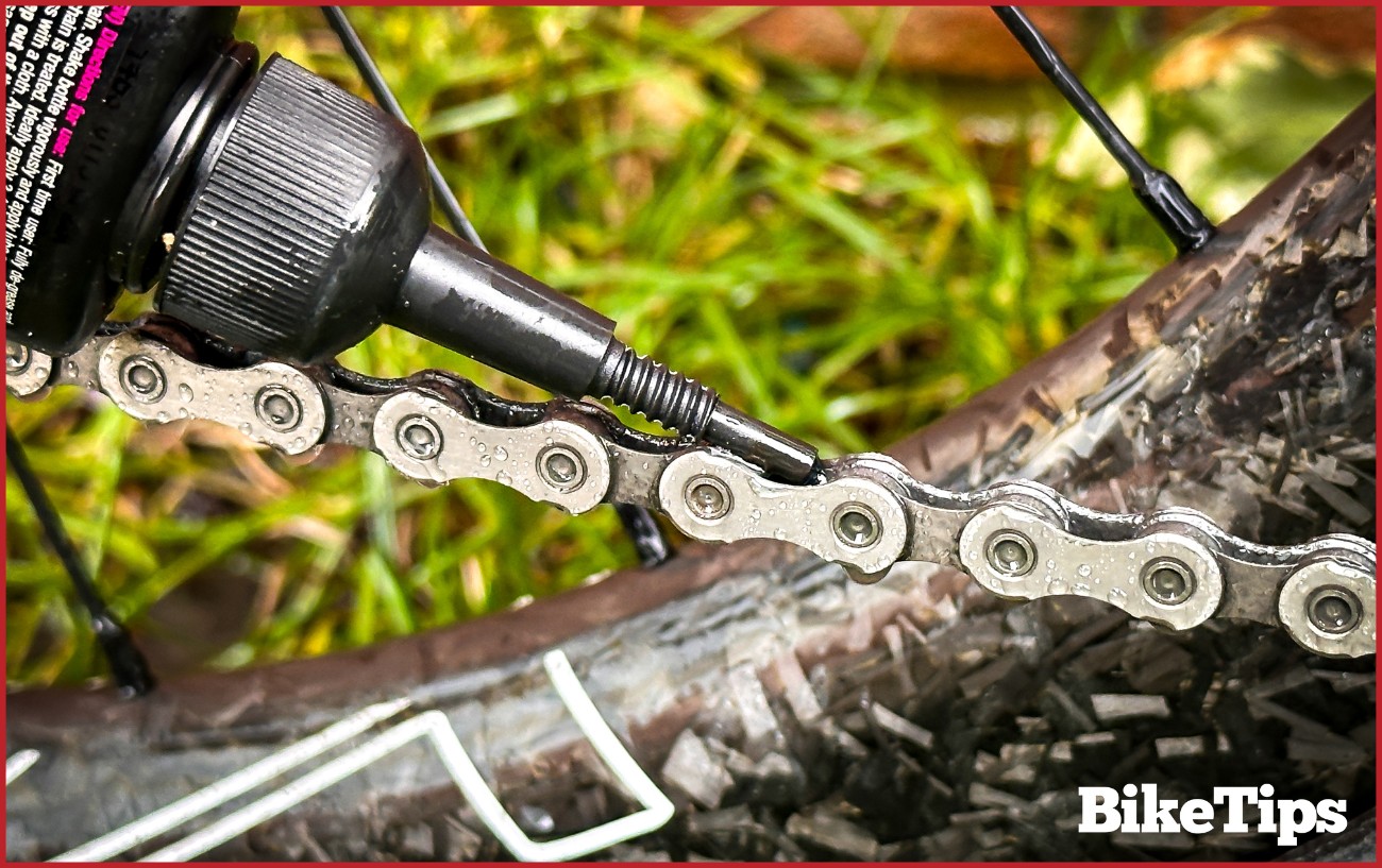 Oiling a bike chain.