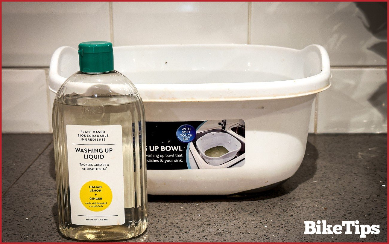 A bowl of water and dishsoap.