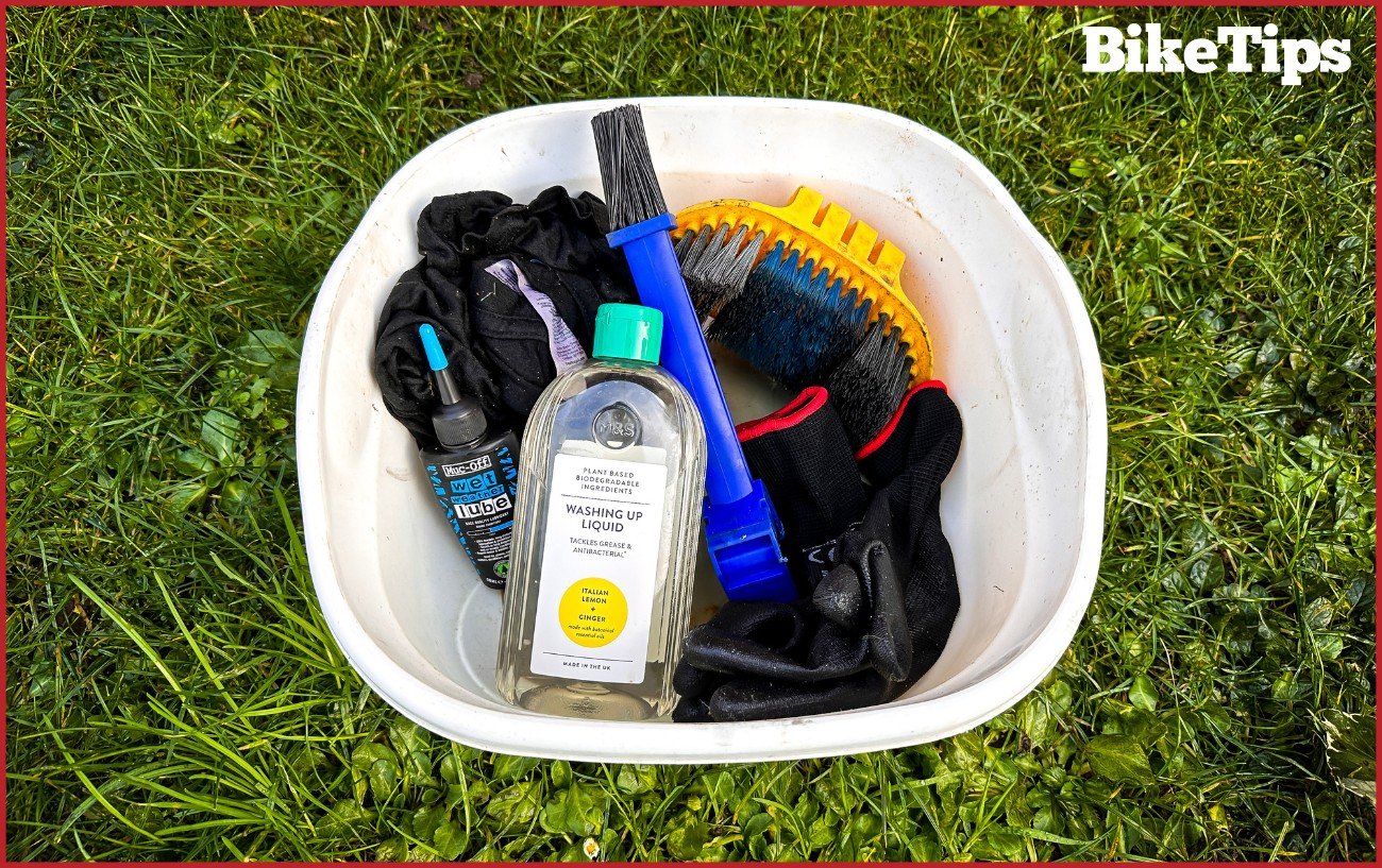A bucket filled with ingredients and equipment for homemade degreasers.