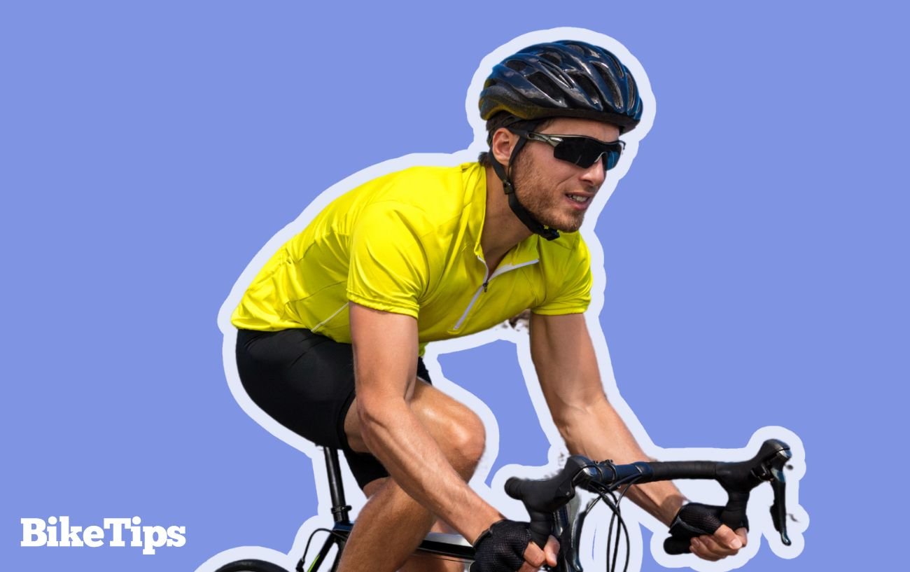 Cyclist with helmet and yellow jersey