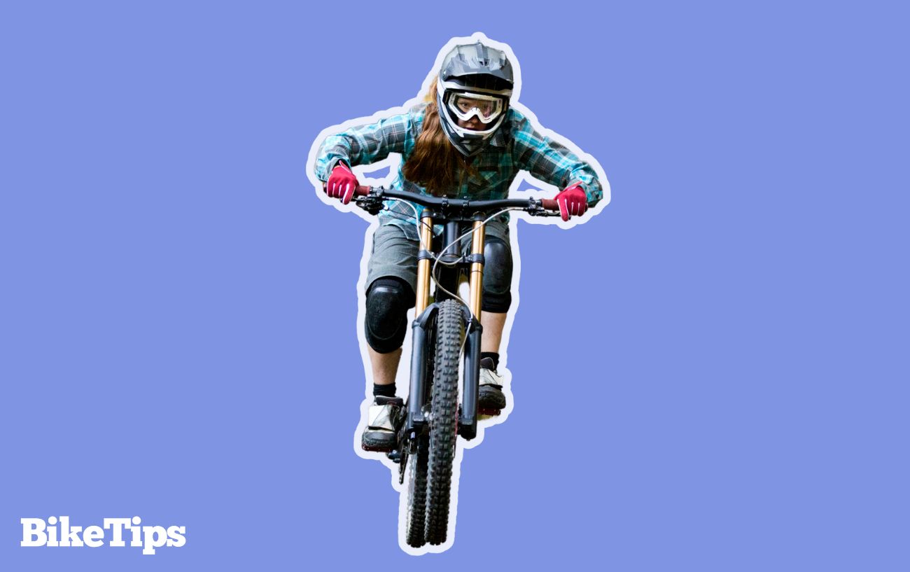 A mountain biker tackles a jump.