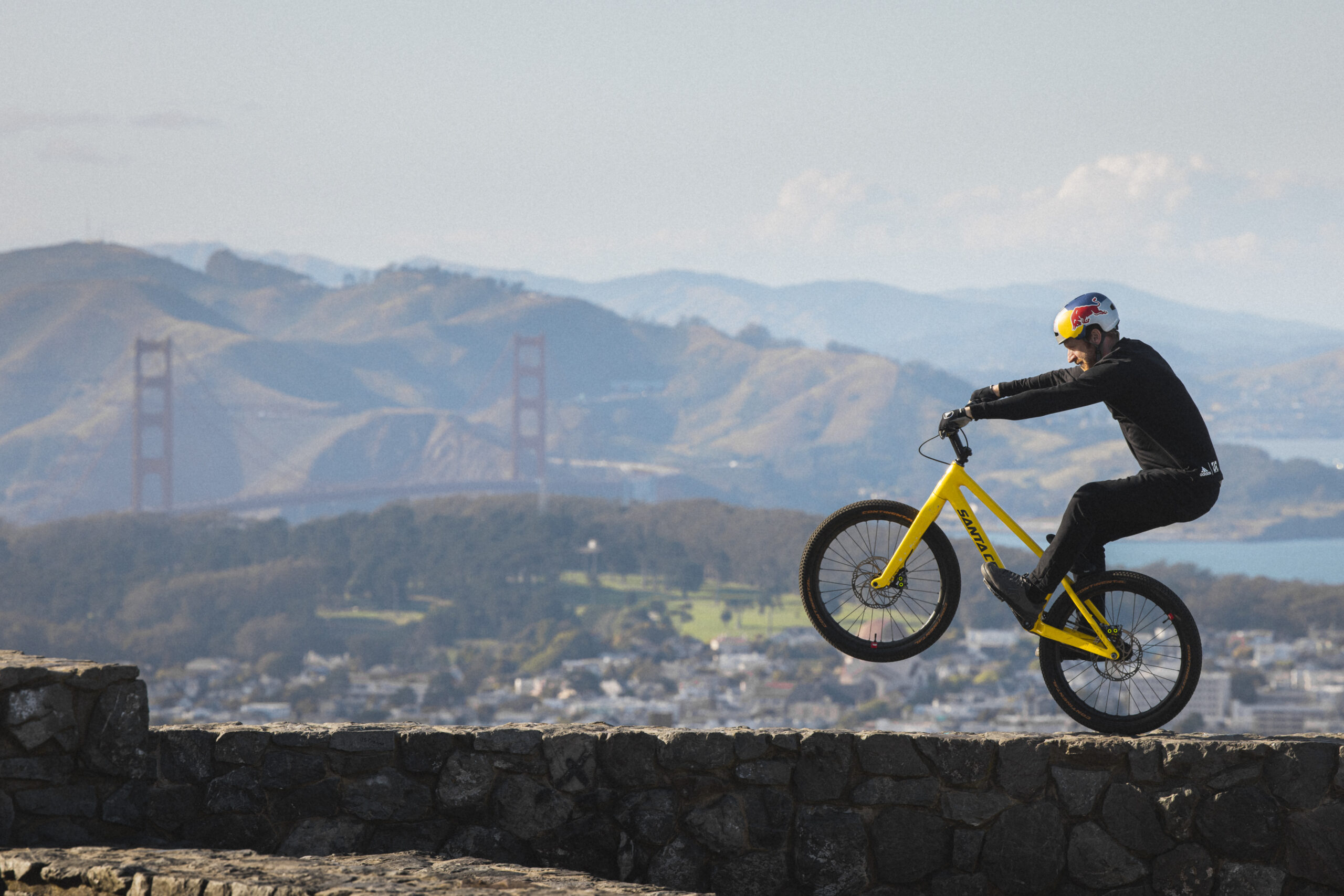 Legendary stunt cyclist Danny MacAskill wheelies on a wall in California.