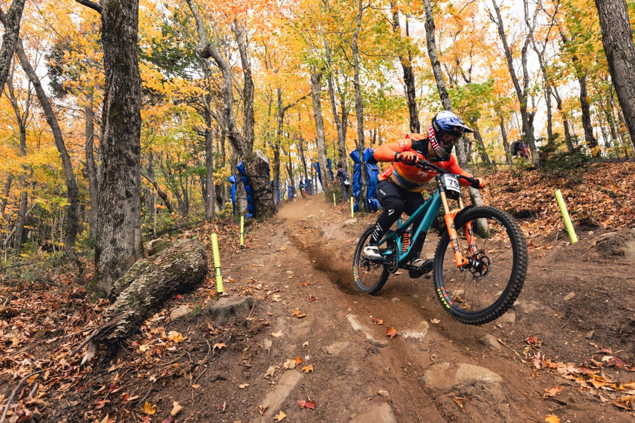 Richie Rude descending on a mullet bike at the Downhill World Cup in Mont Sainte Anne, Canada in October 2023.