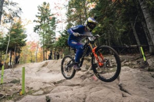 Bernard Kerr charging on a mullet bike at the UCI Downhill World Cup in Mont Sainte Anne, Canada, in October 2023.