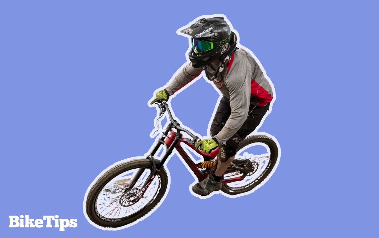 A mountain biker demonstrates one-finger braking technique.