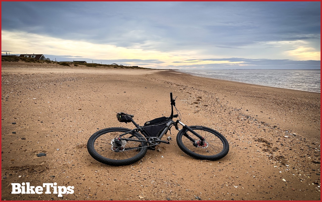 A hardtail mountain bike on the beach.