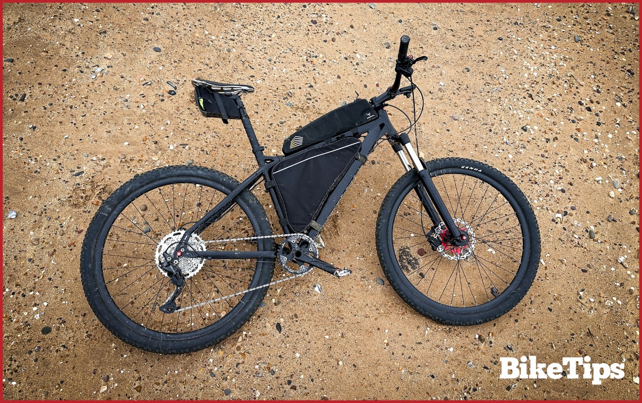 A hardtail mountain bike on the beach.