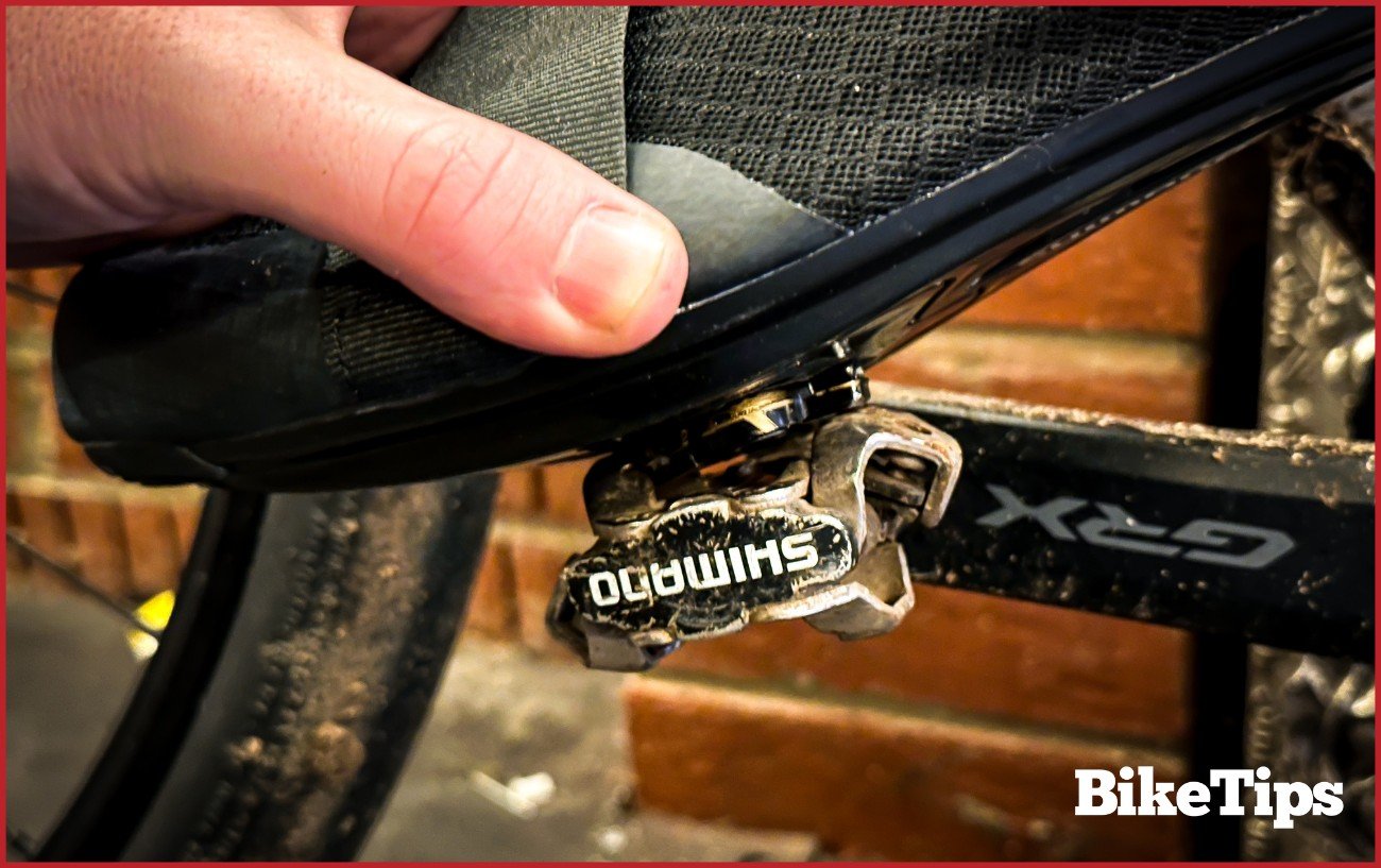 An SPD cleat being clipped in.