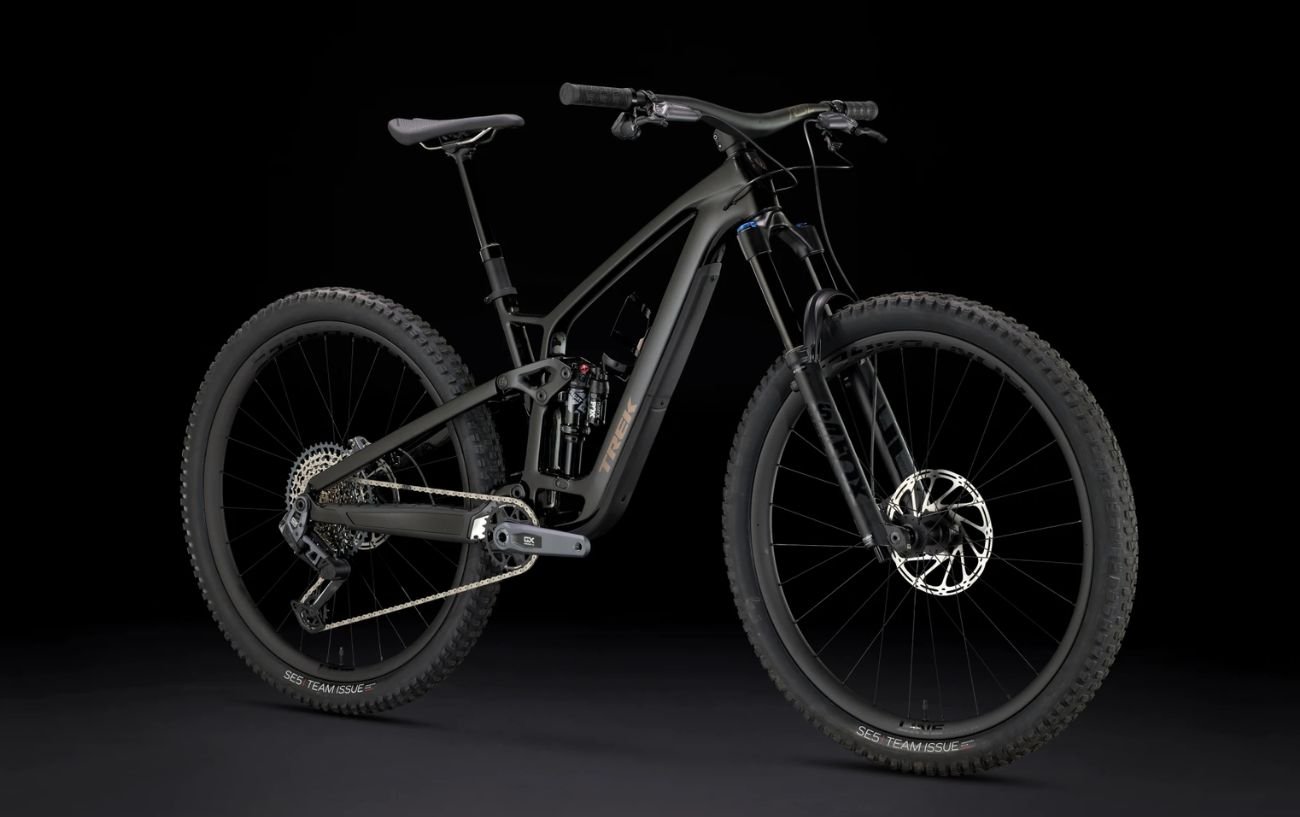 Trek Fuel mountain bike on a black background.