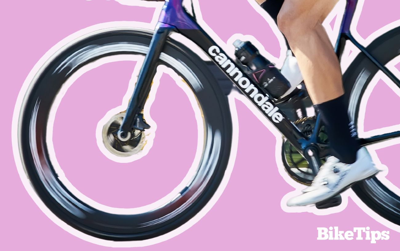 Cannondale road bike on a pink background.
