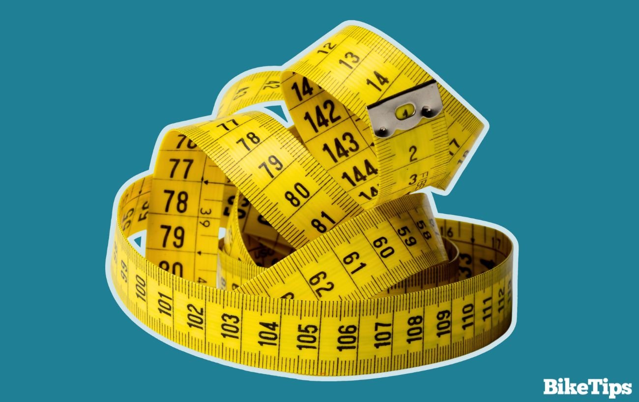 Measuring tape on a blue background.