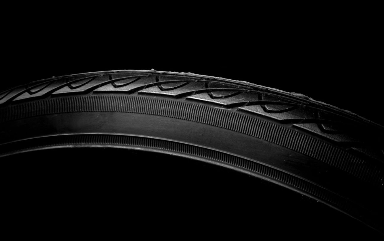 David Lavery 4 Photo of a wire bead tire on a black background.