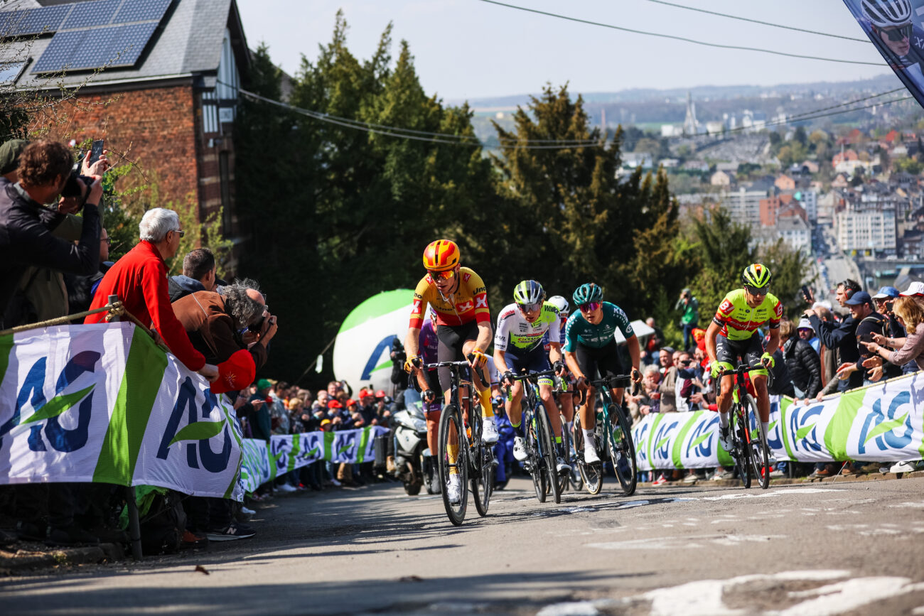 Cyclists climbing a steep hill at the 2023 Fleche Wallone.