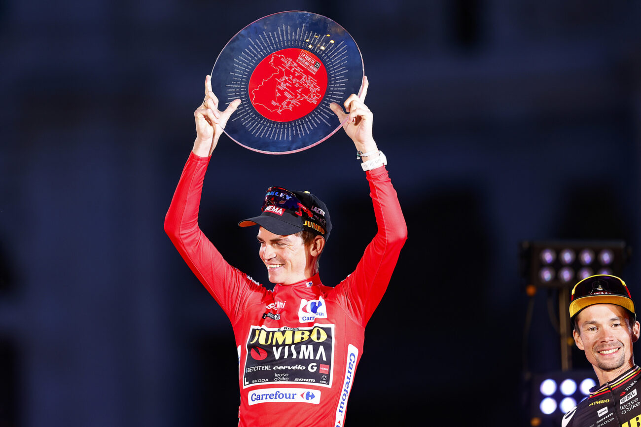 Sepp Kuss holds the Vuelta a Espana trophy.