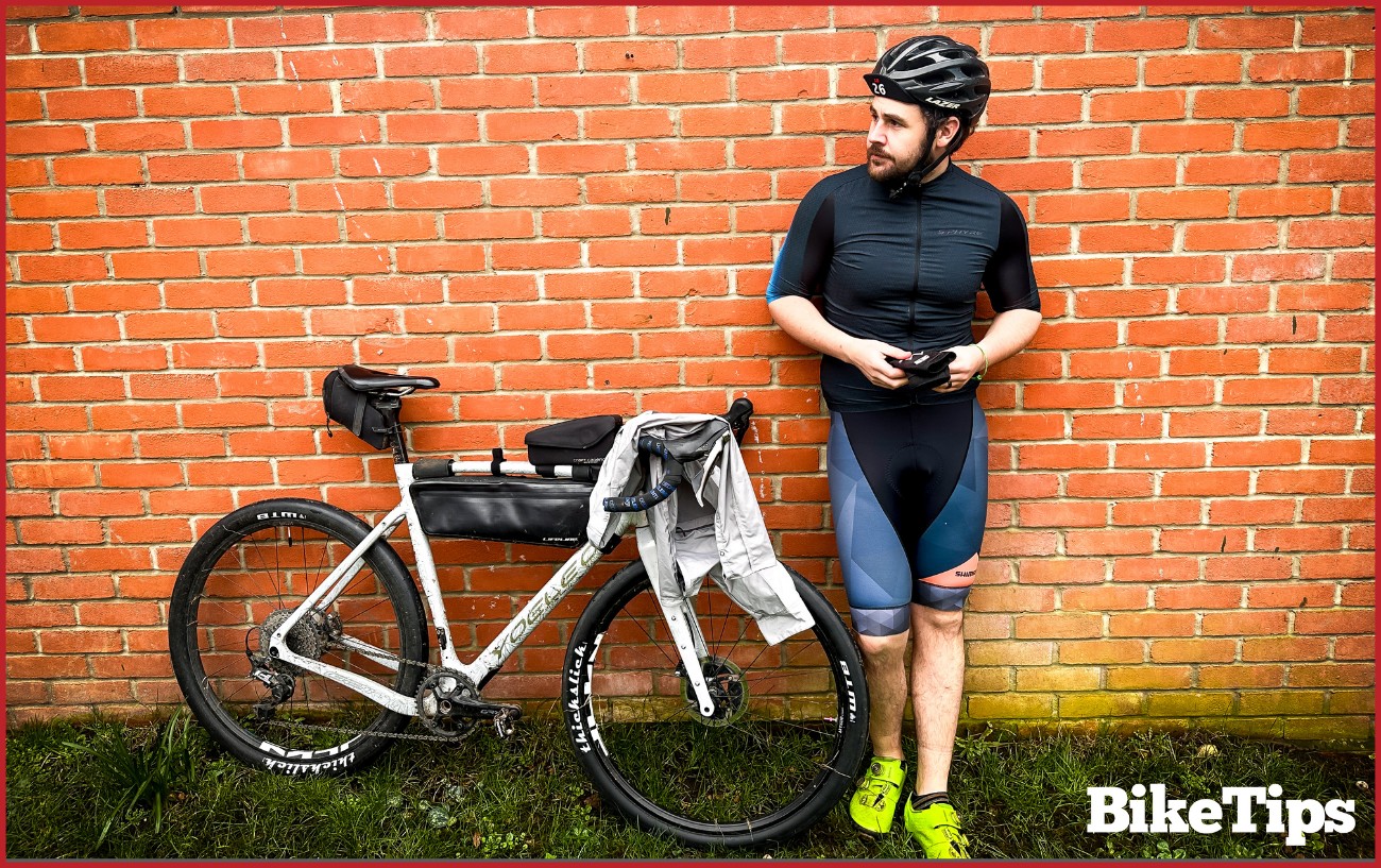 A cyclist in spring clothing.