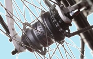 Photo of an internal gear hub on a bike on a blue background.