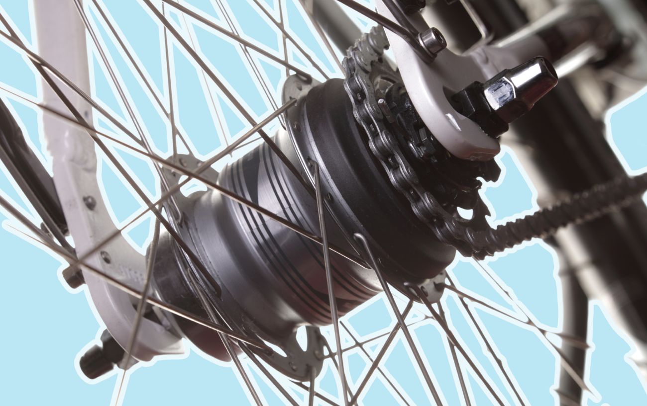 Photo of an internal gear hub on a bike on a blue background.