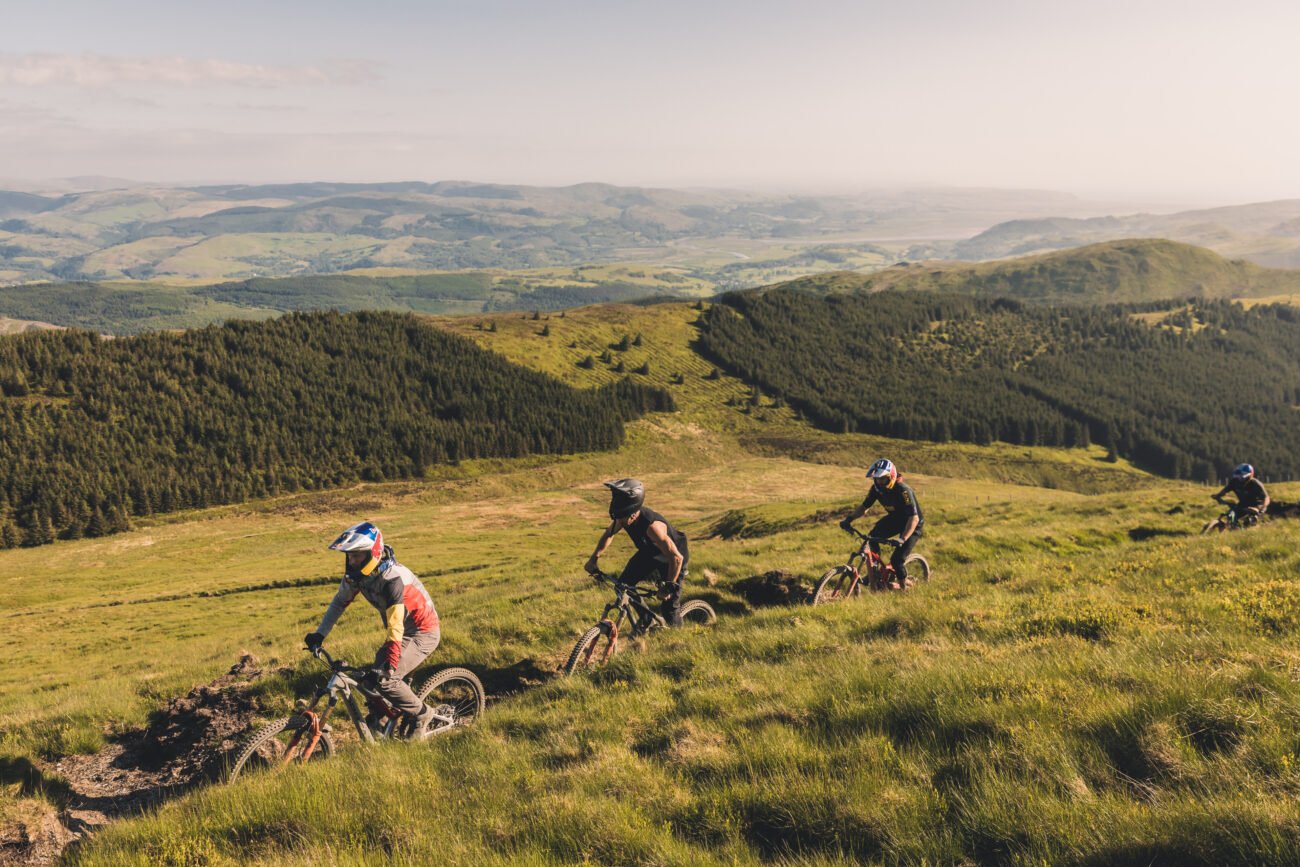 Enduro MTB riders during a race transition stage.